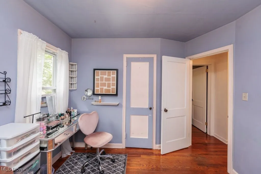 Office area featuring wood finished floors and baseboards