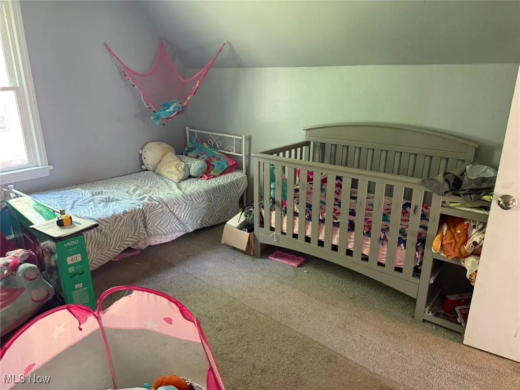 Bedroom featuring carpet flooring