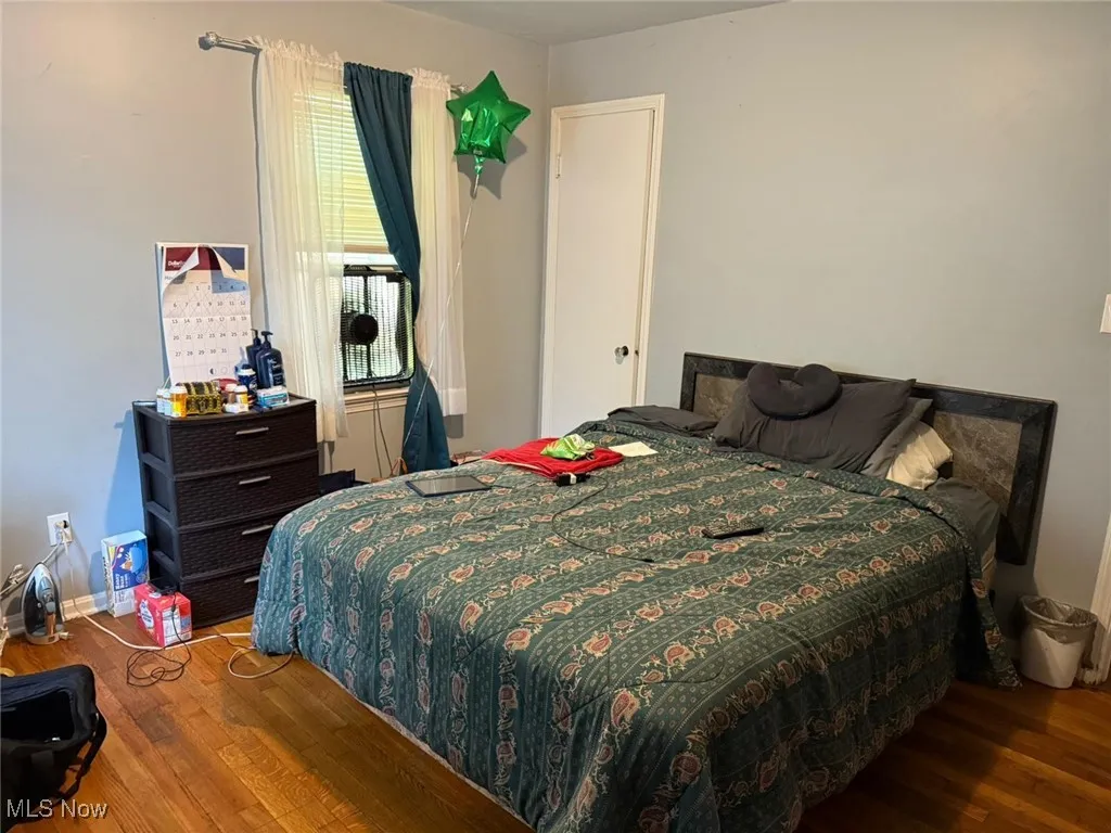 Bedroom featuring wood finished floors