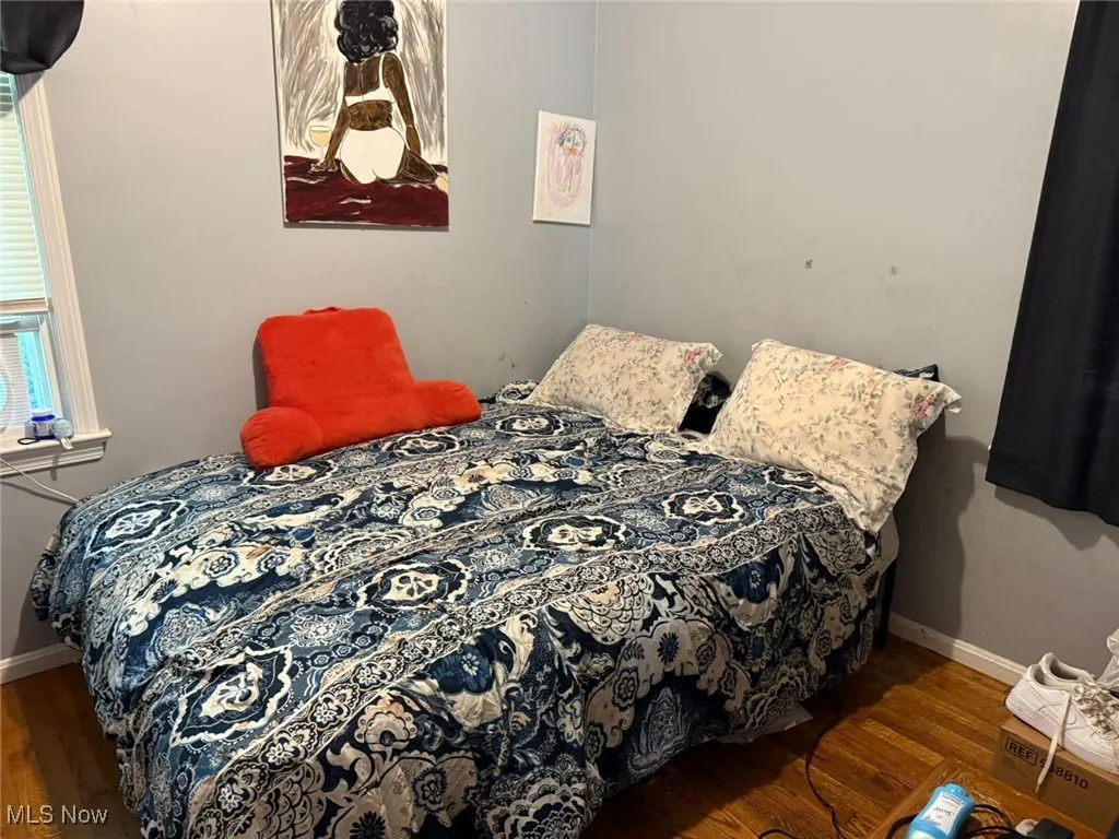 Bedroom featuring wood finished floors