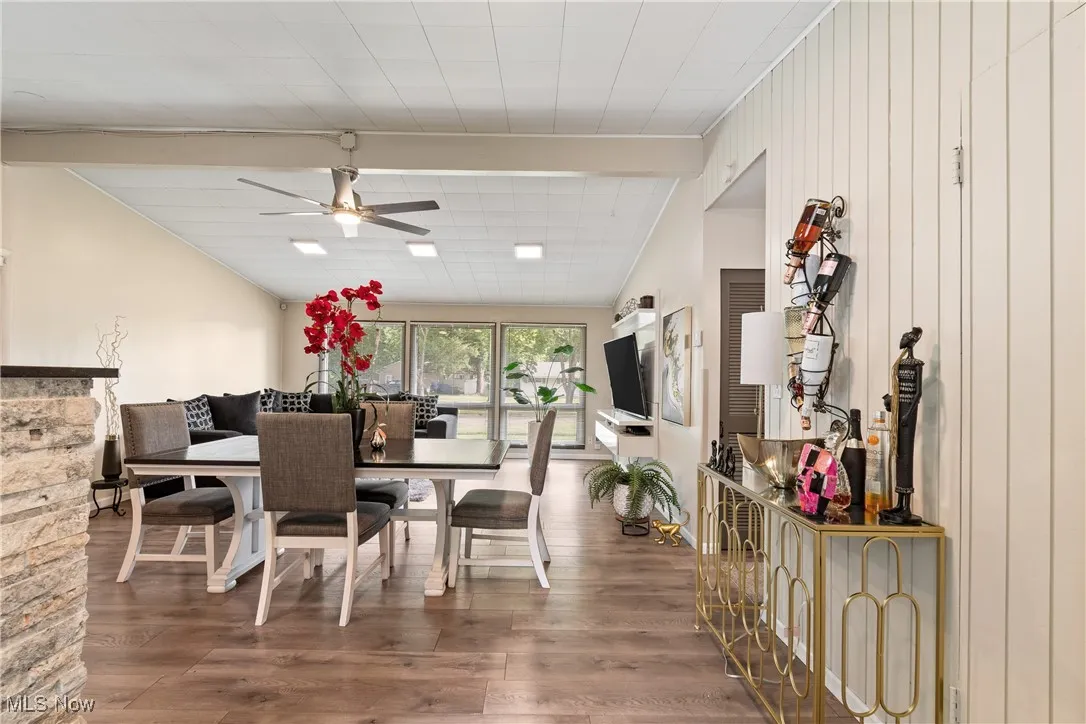 Dining room featuring a ceiling fan and wood finished floors