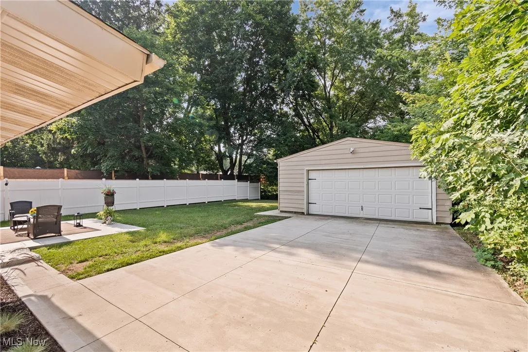 View of yard with an outbuilding and a detached garage