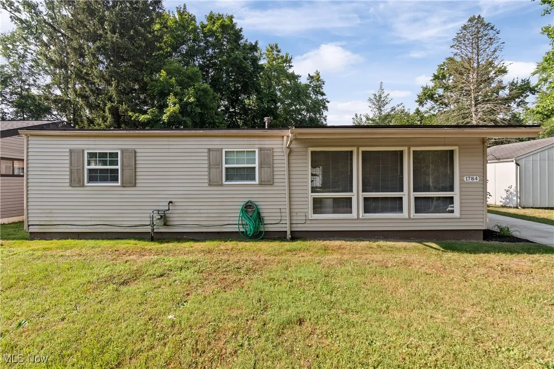View of front of house with a front yard