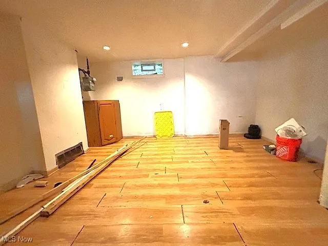 Basement featuring wood finished floors and recessed lighting