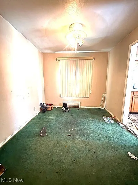 Unfurnished room with carpet floors and baseboards