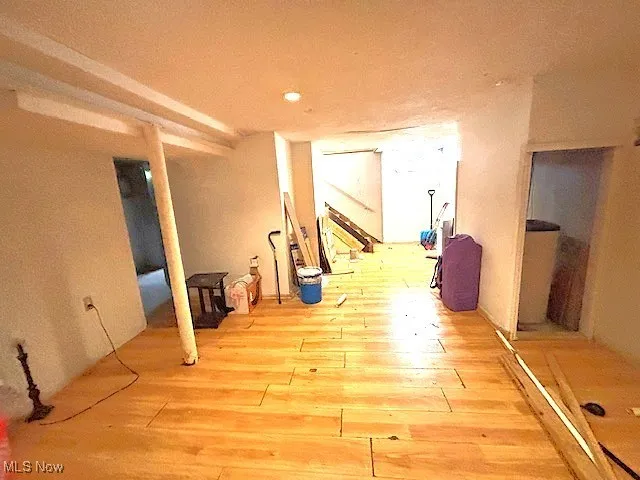 Corridor featuring hardwood / wood-style floors