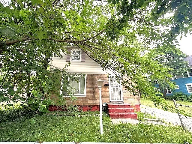 View of front of house featuring brick siding
