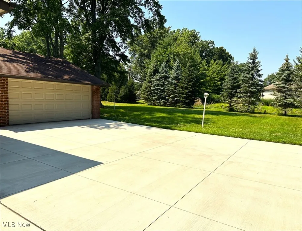2-car detached garage with beautiful cement driveway new in 2022