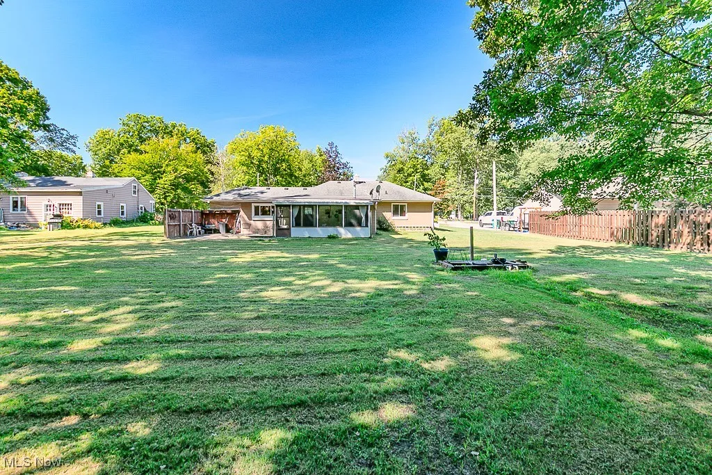 View of yard with a sunroom