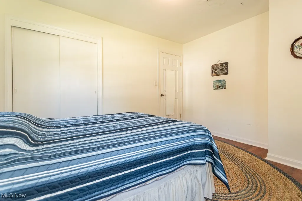 Bedroom featuring a closet and wood finished floors