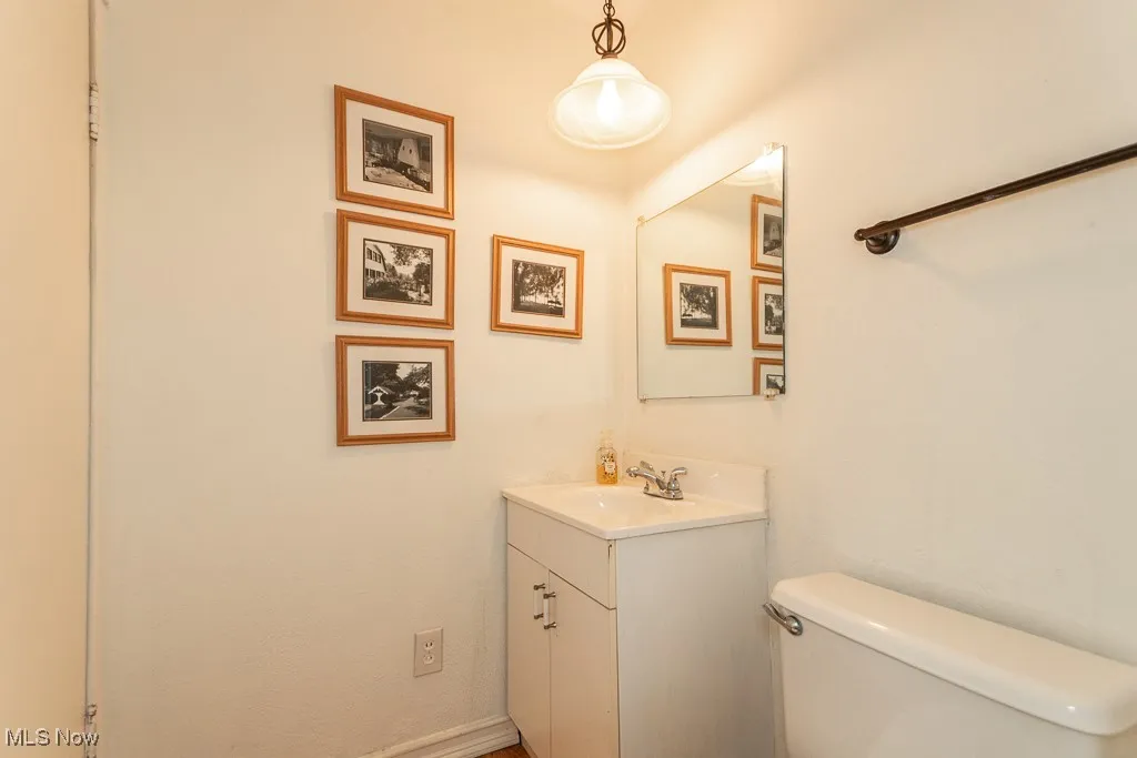 Half bath featuring vanity and toilet