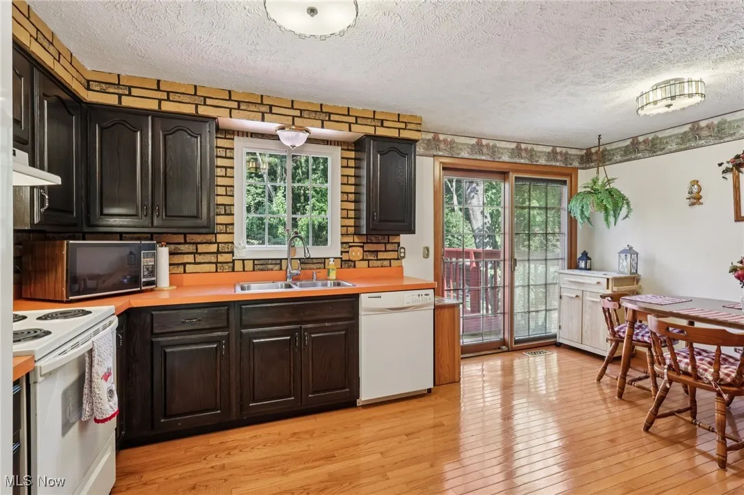 spacious eat-in kitchen with two pantries and slider providing entry to back yard 2 level deck. All appliances stay!