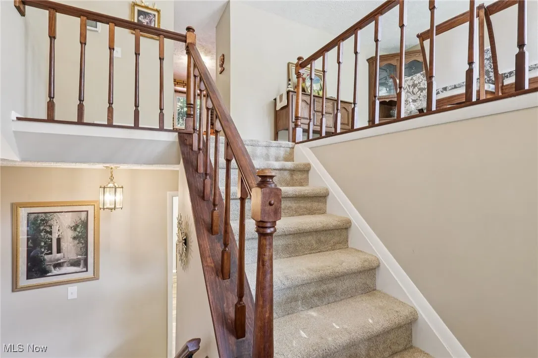 stairs leading to upper level and lower level