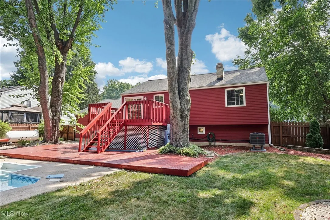 Beautifully landscaped fenced in backyard with 2 level deck and heated in-ground pool for relaxing and entertaining!