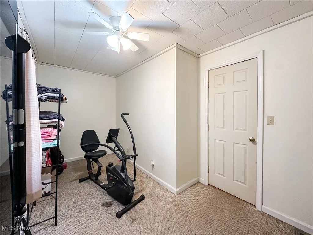 Bedroom with ceiling fan.