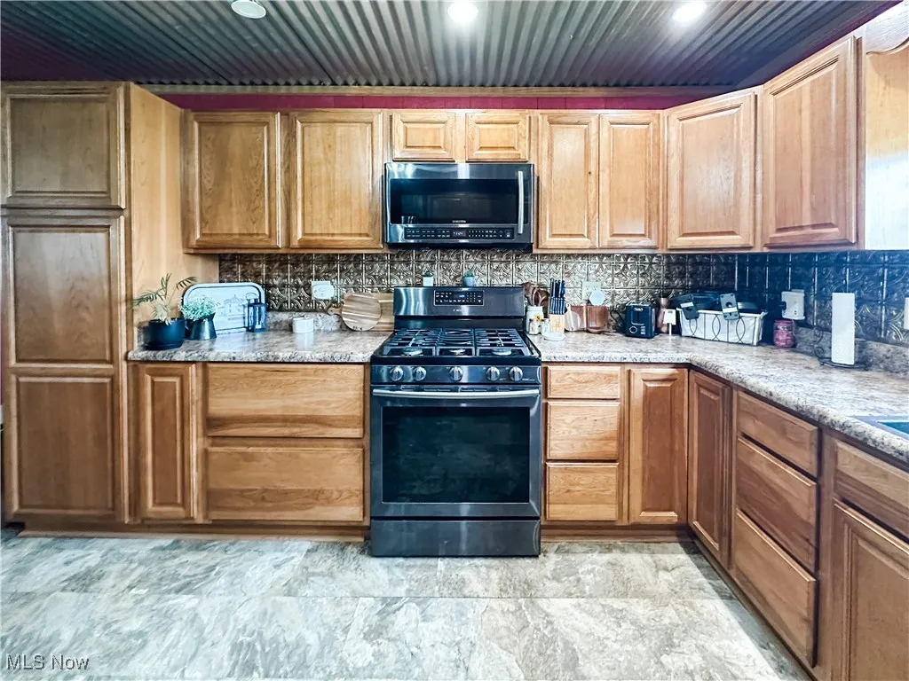 Updated kitchen with soft-close cabinetry.
