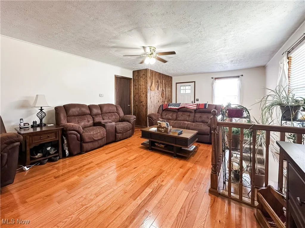 Open living room with new wood flooring.