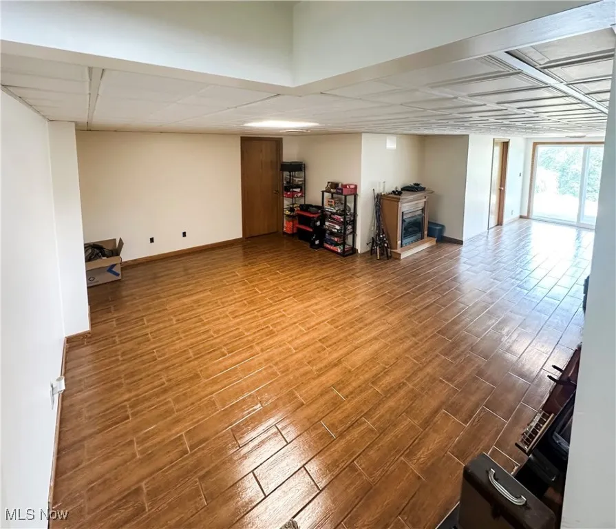 Spacious partially finished basement with natural light and outside access.
