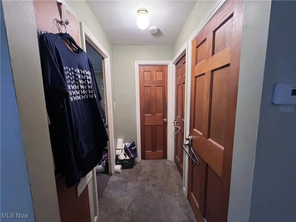 Doorway featuring carpet