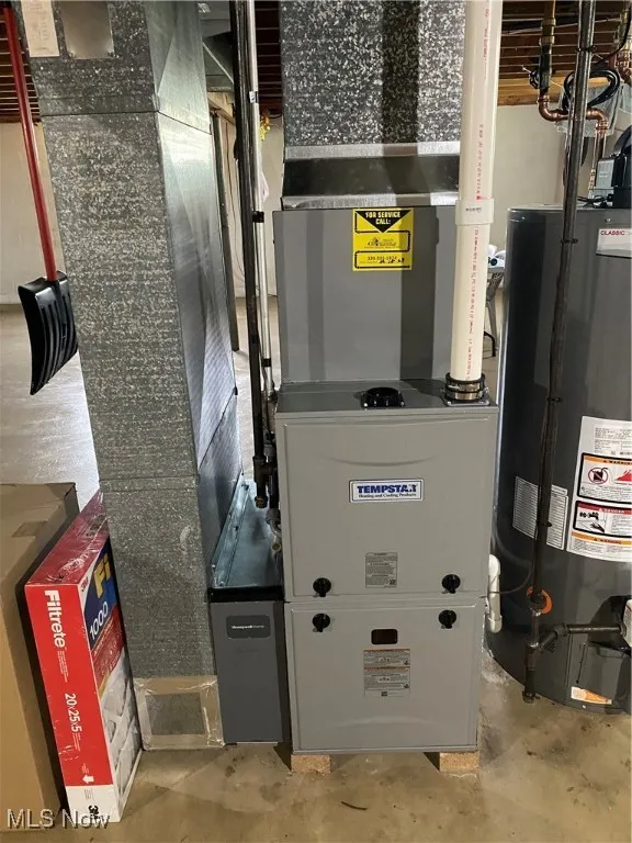 Utility room with water heater and heating unit