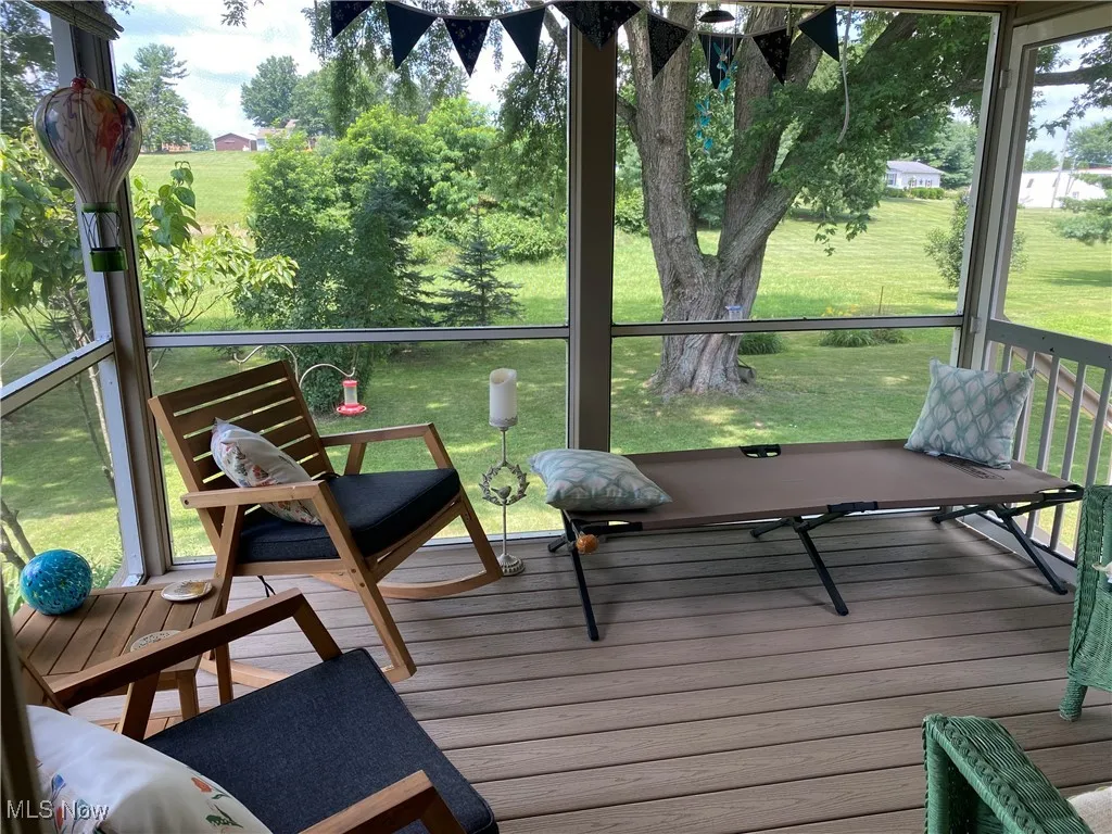Sunroom / solarium featuring healthy amount of natural light