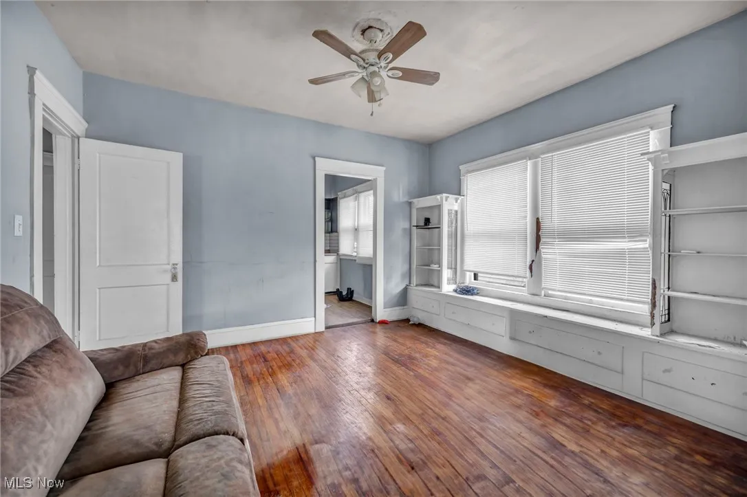 Bedroom with baseboards and hardwood / wood-style floors
