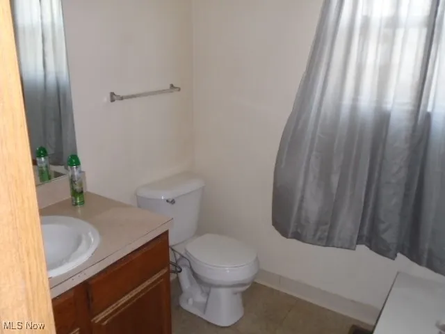 Bathroom featuring vanity and tile patterned floors