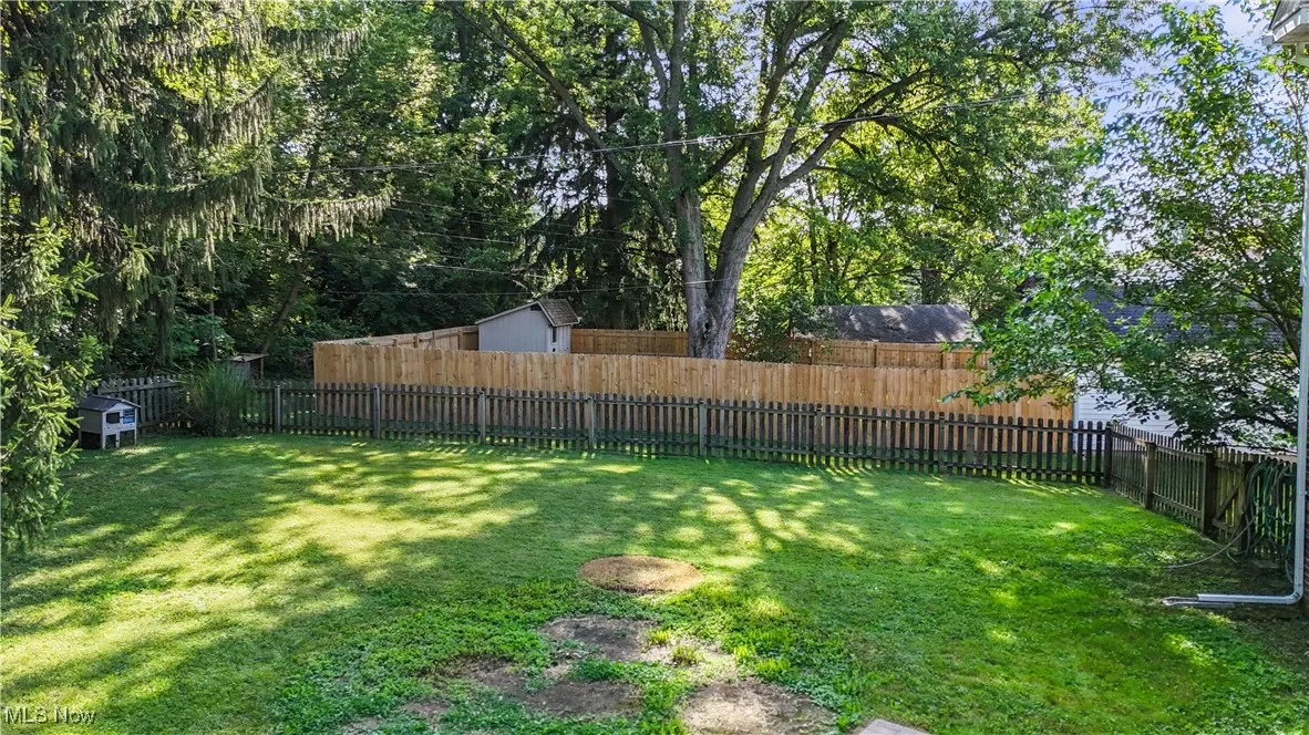 View of fenced backyard