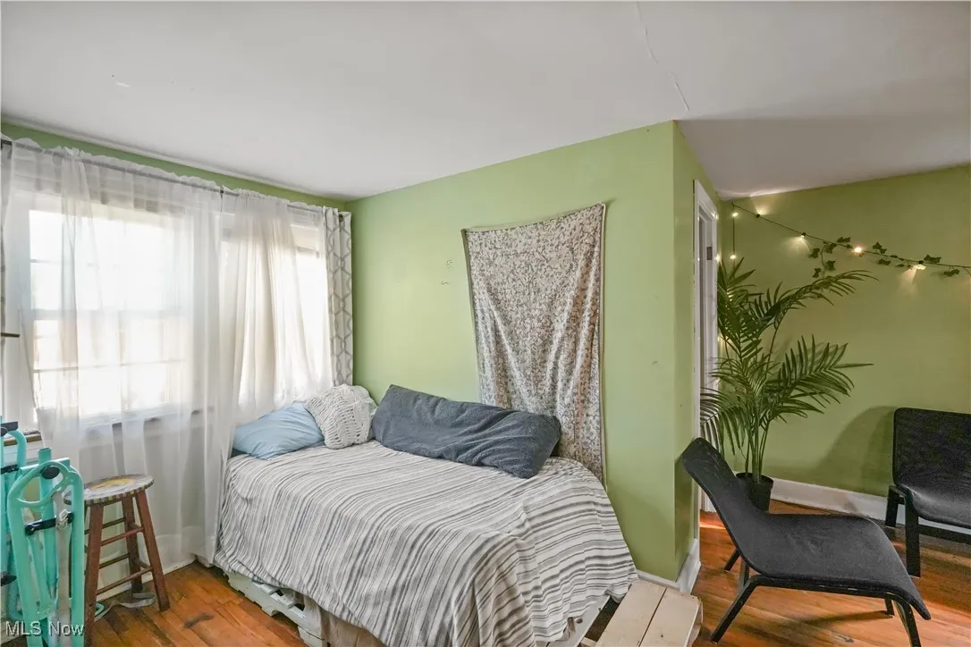 Bedroom with wood finished floors