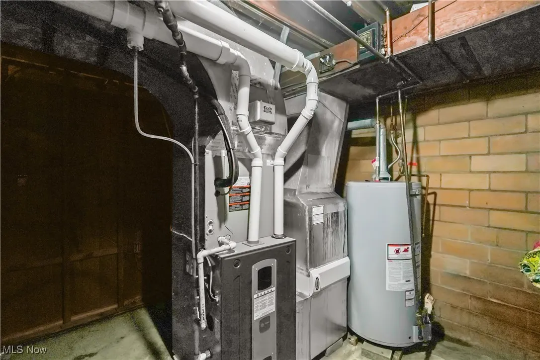 Utility room with water heater and heating unit