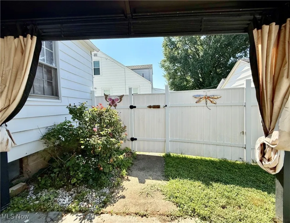 Fenced Backyard with concrete Pad