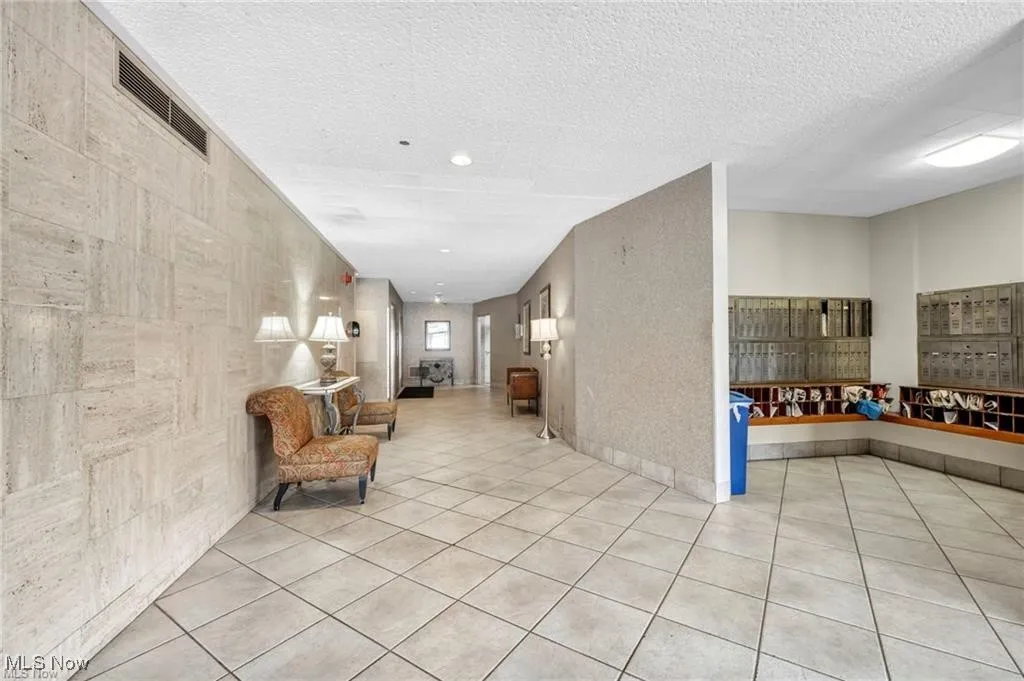 Lobby featuring a textured ceiling and recessed lighting