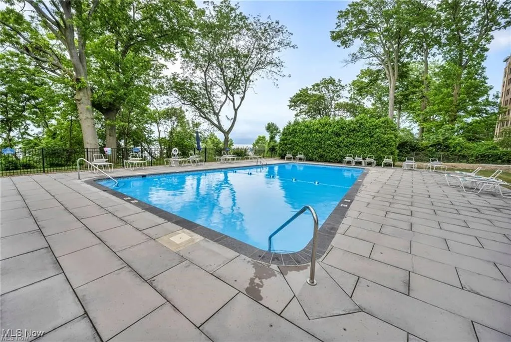 Community pool with a patio area