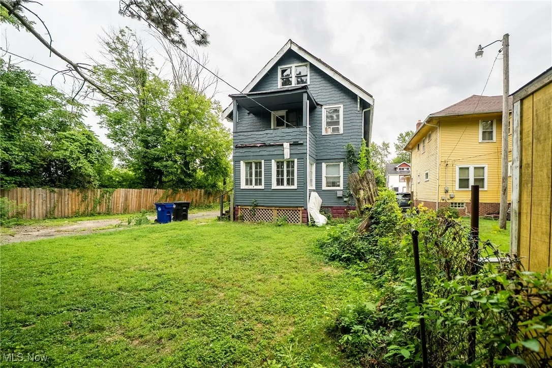 Rear view of property with a balcony
