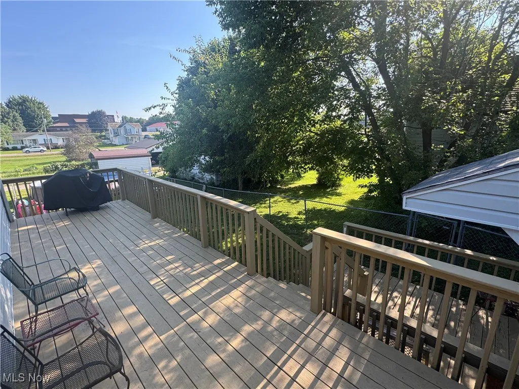Deck featuring a fenced backyard and area for grilling