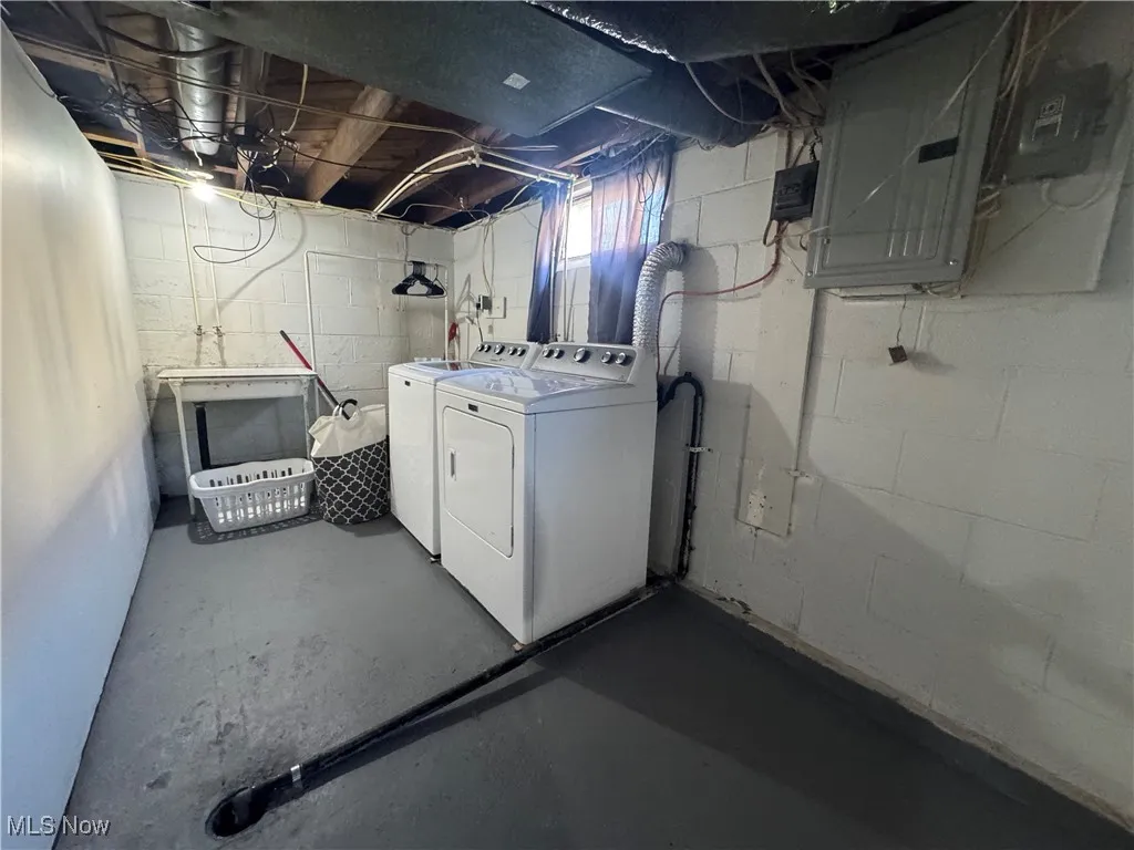 Below grade area with independent washer and dryer and electric panel