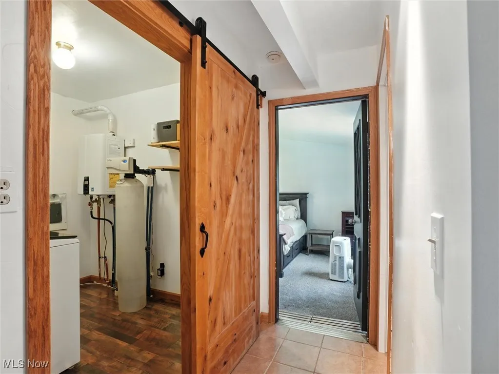 Laundry room on first floor with barn door