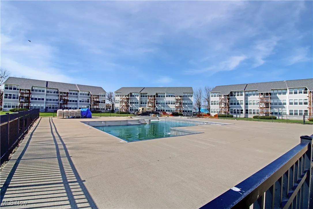 Community pool with a patio area