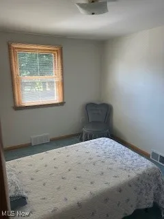 Bedroom featuring baseboards