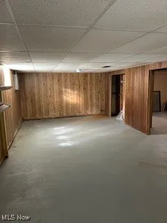Finished below grade area featuring a drop ceiling
