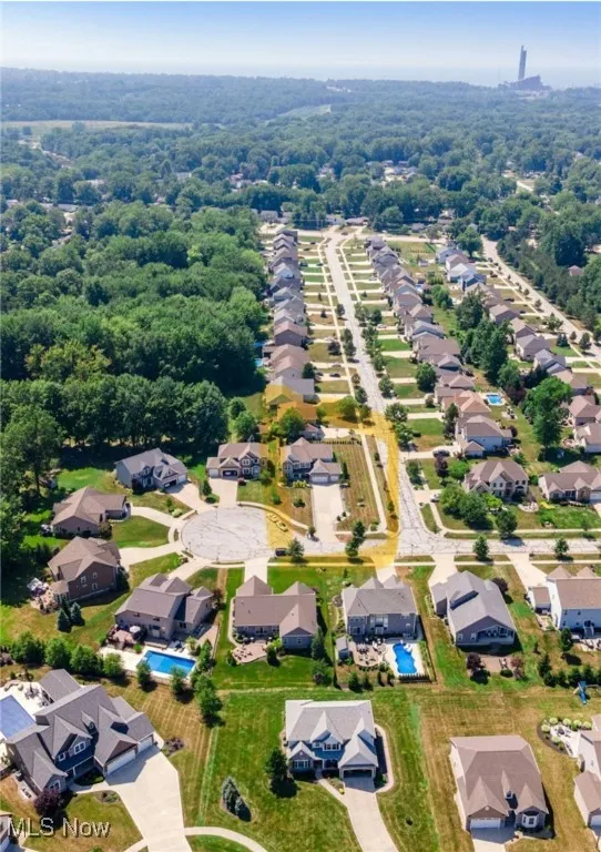 View of property location with nearby suburban area