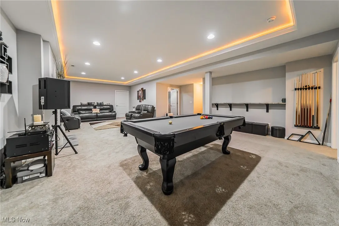 Playroom with carpet flooring, a raised ceiling, pool table, and recessed lighting