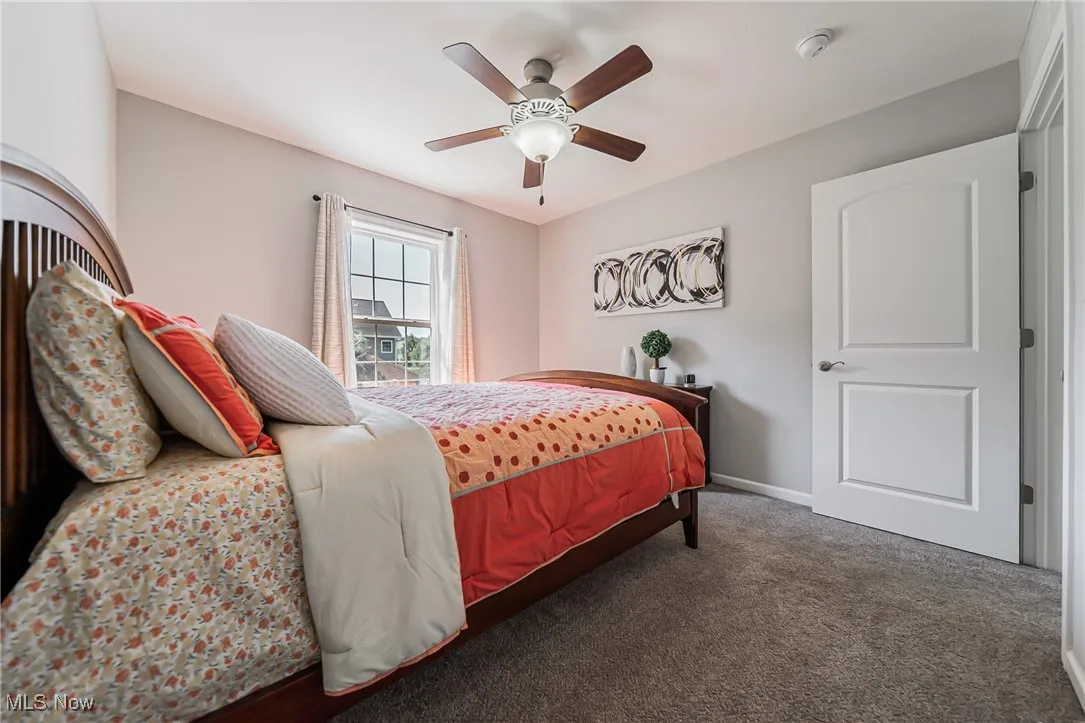 Bedroom featuring carpet flooring and ceiling fan