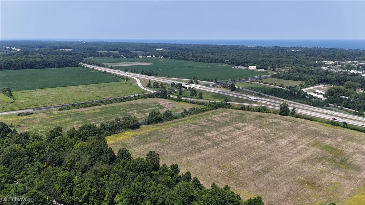 Aerial view of sparsely populated area featuring extensive farmland