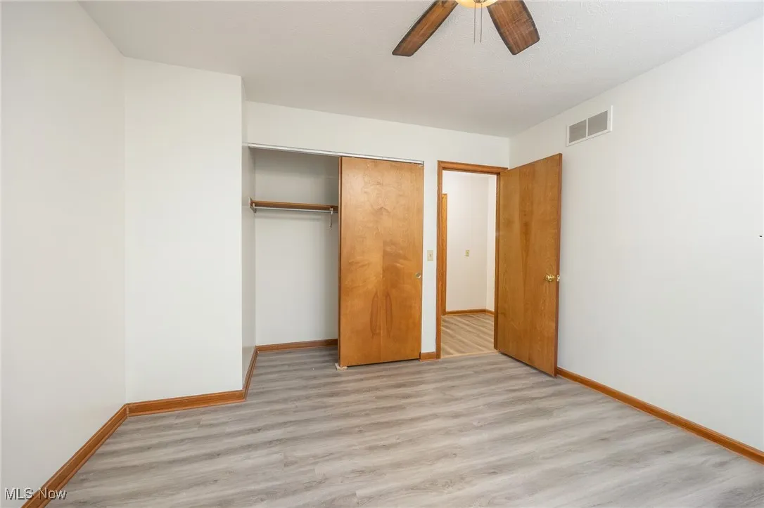 Bedroom with a closet, and a ceiling fan