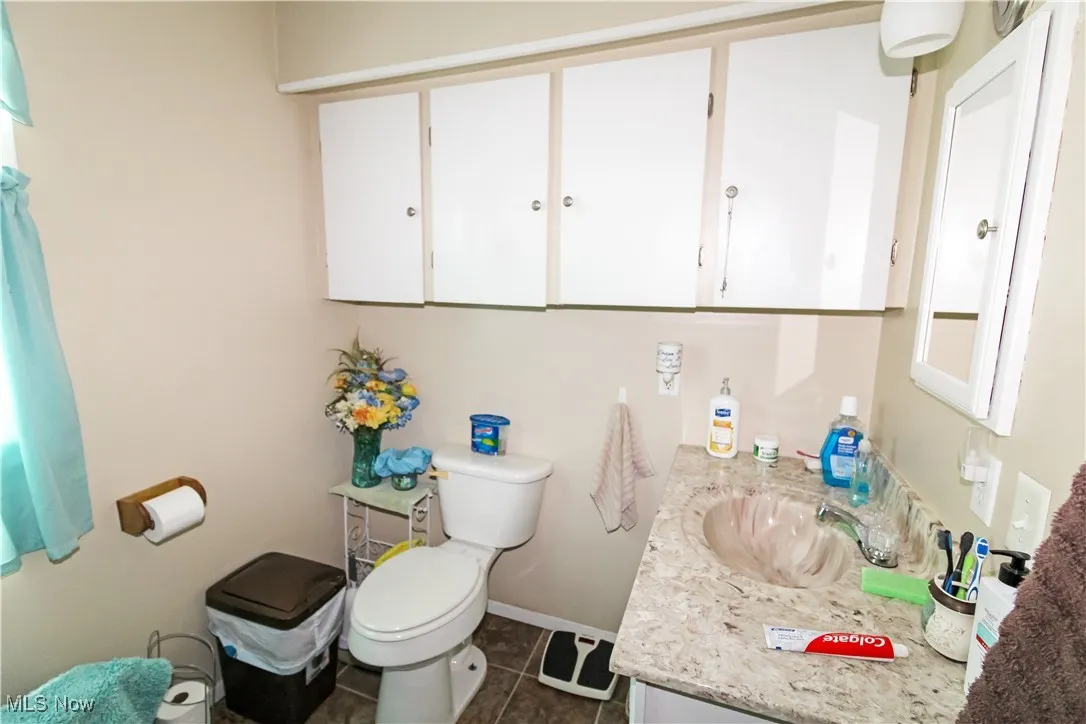 Bathroom with vanity and tile patterned floors