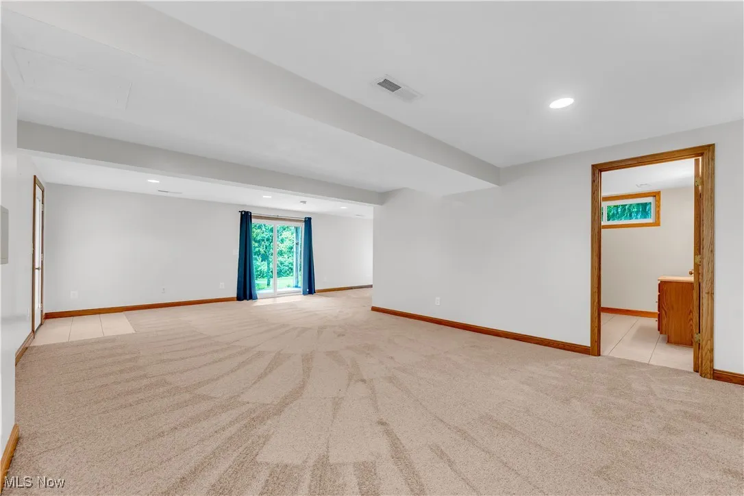 Unfurnished room featuring light carpet and recessed lighting