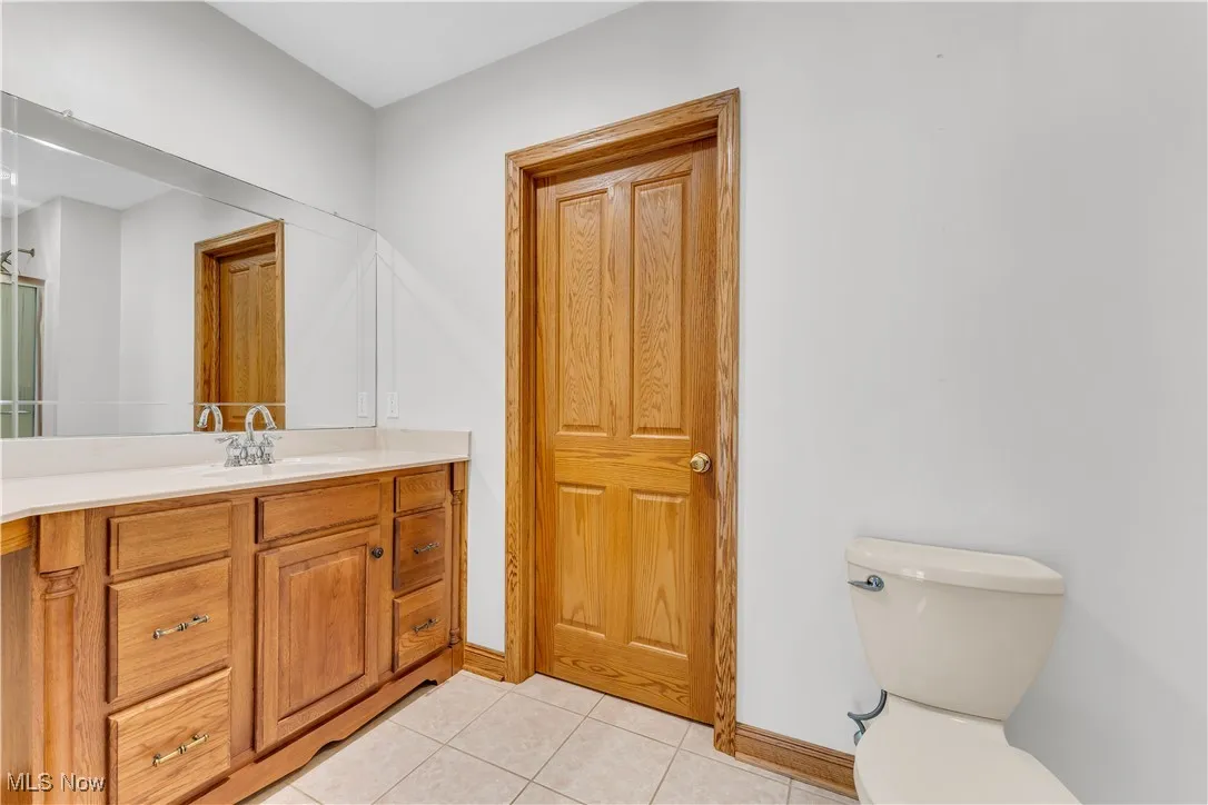 Bathroom with vanity and tile patterned flooring