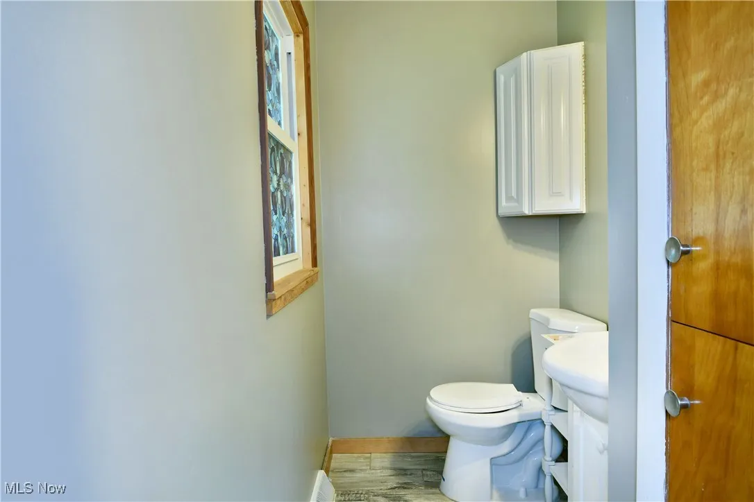 Bathroom with wood finished floors and vanity