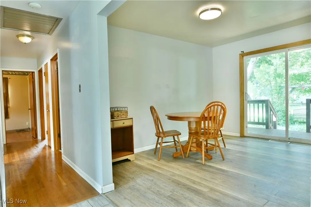 Dining space with light wood-style flooring